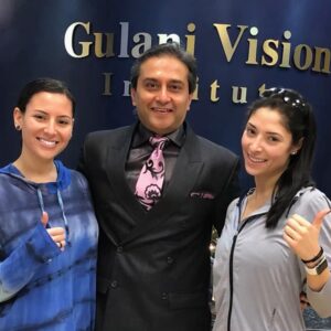 Dr. Gulani standing with a happy patient who achieved 20/20 vision after being told she was not a LASIK candidate due to thin corneas.