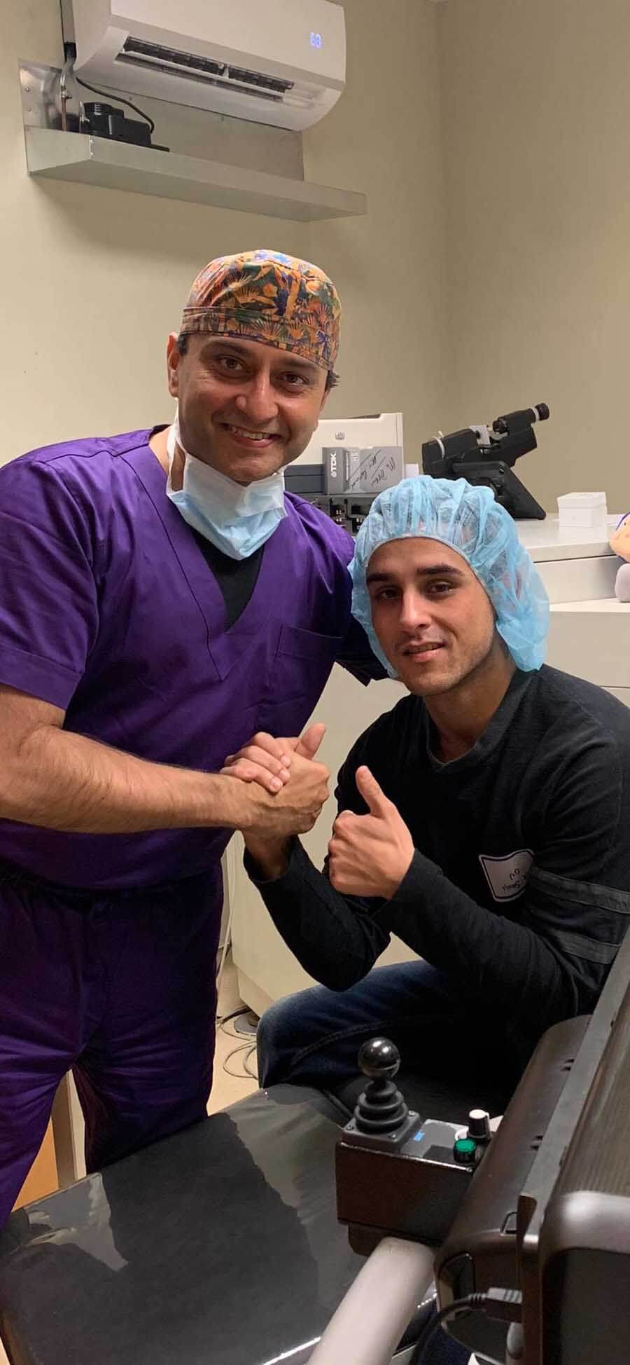 Dr. Gulani Posing With a Patient