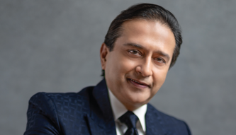 Headshot of Dr. Arun C. Gulani, renowned eye surgeon featured in The Ophthalmologist for his innovative contributions to vision correction and cataract surgery.